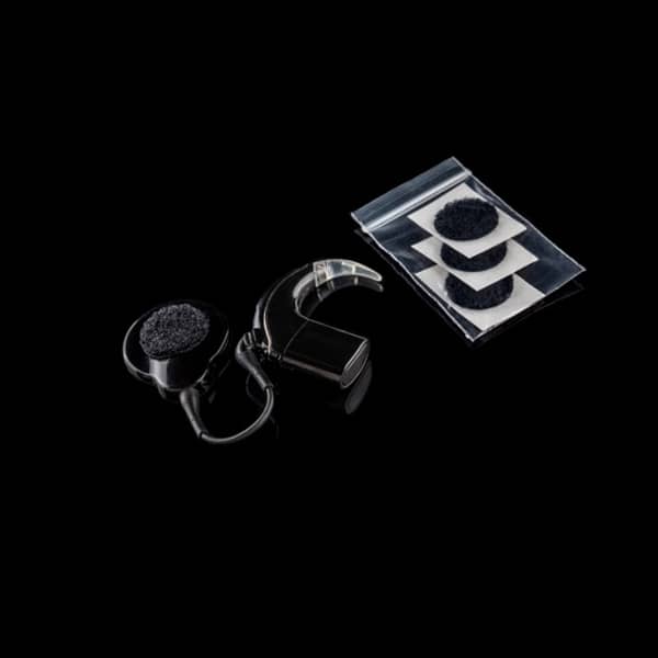deaf metal hearing aid jewellery shown on hearing aid