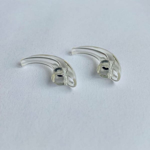 Widex D 9 series ear hooks against white background