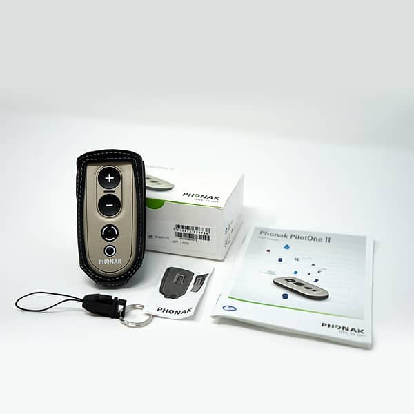 Phonak PilotOne 2 with contents of packaging laid out