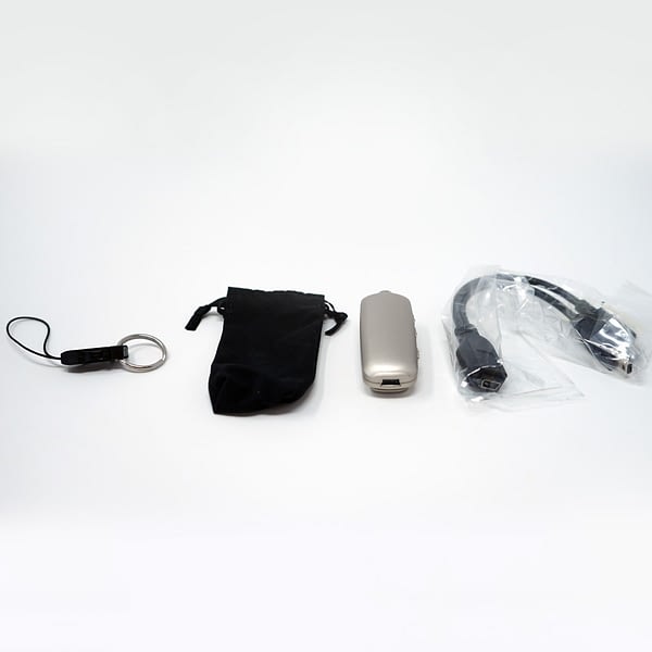 Remote mic and accessories laid out on white background