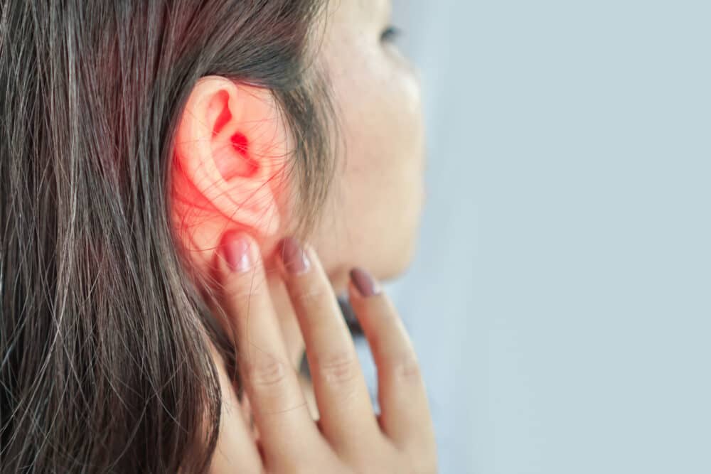 Woman suffering from ear pain