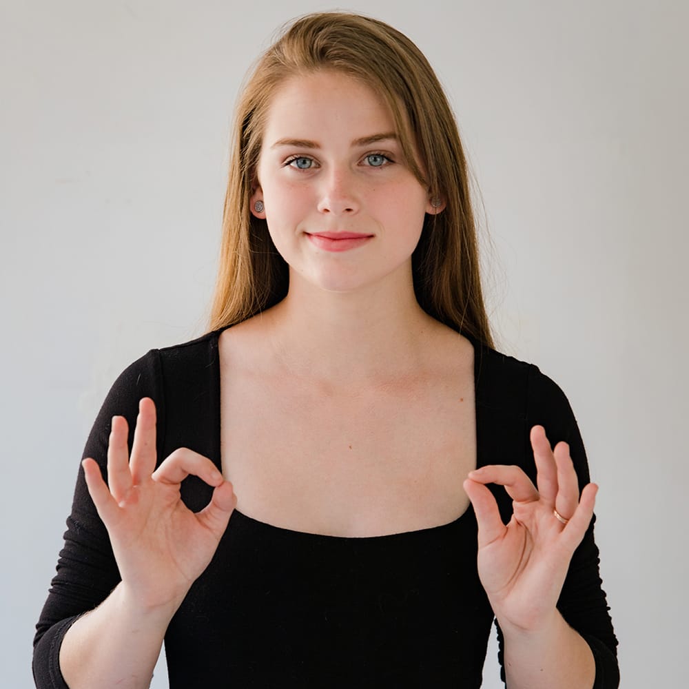Deaf person demonstrating sign language