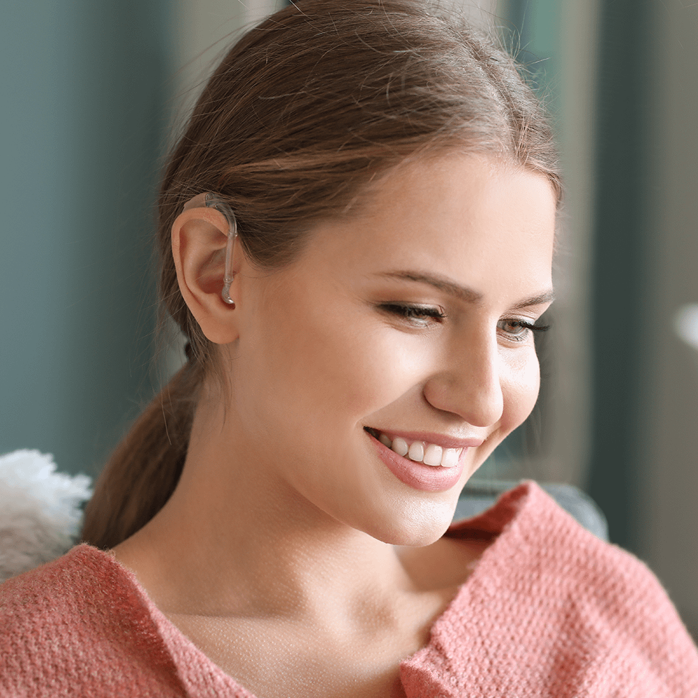 Woman wearing hearing aid smiling