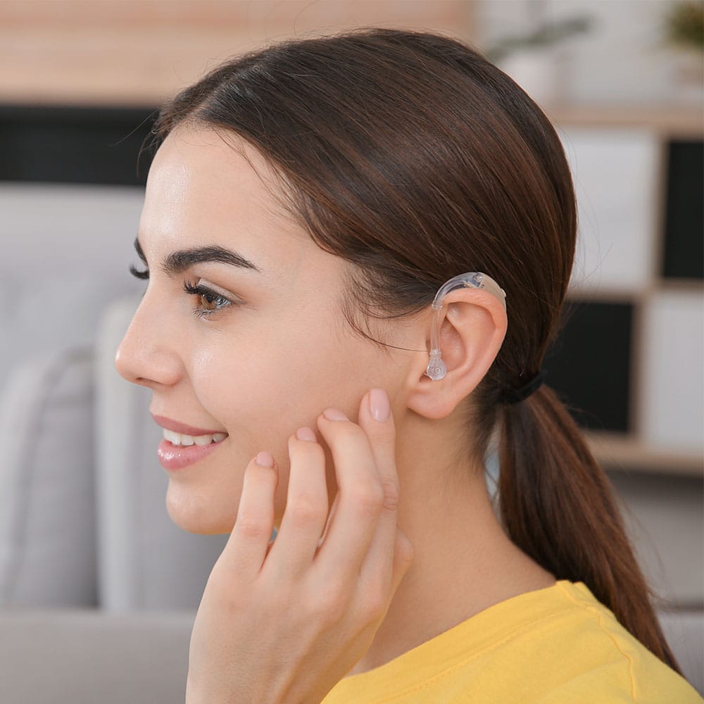 Young woman wearing a hearing aid