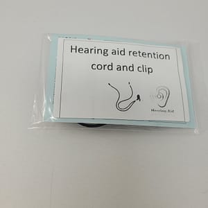 Hearing aid retention cord and clip