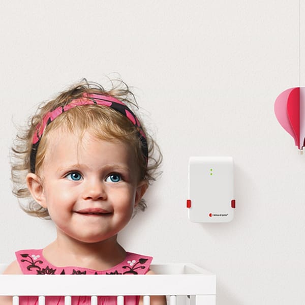 Bellman baby monitor wall mounted next to infant child