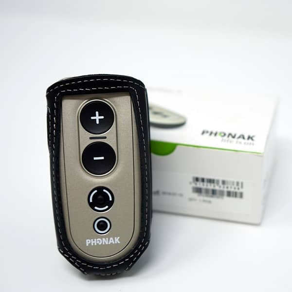 Phonak PilotOne 2 with leather wrap infront of box