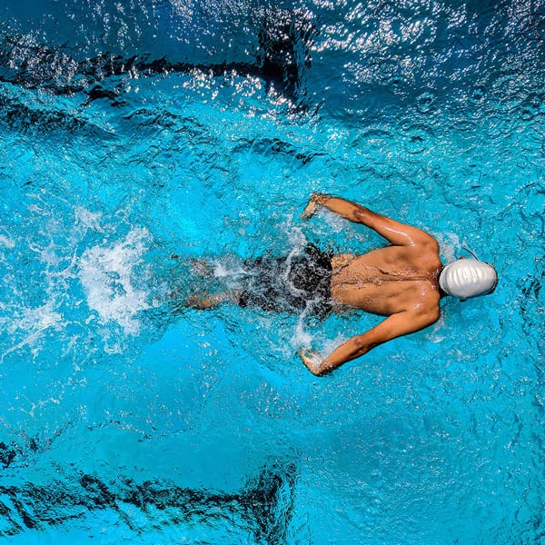 Swimmer using Swim Plugs