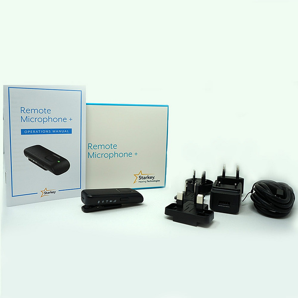 remote microphone alongside contents of box